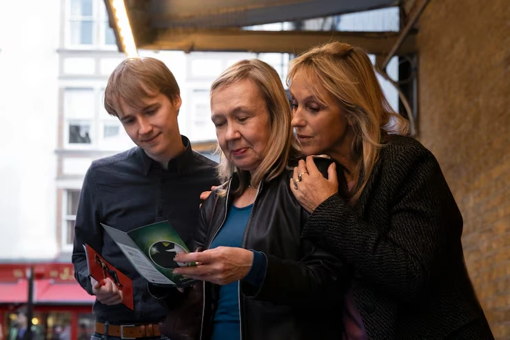 Event management team reviewing client feedback and testimonials with satisfied customers