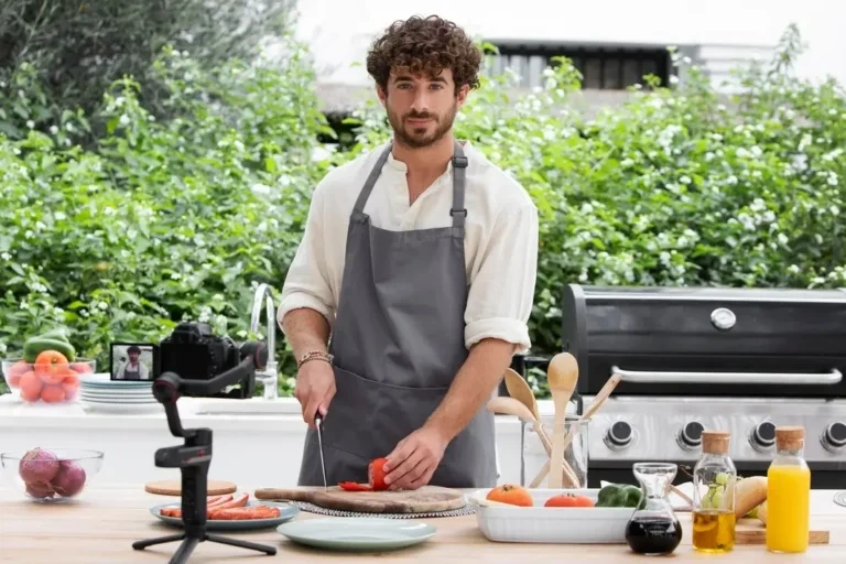 Chef chopping vegetables at outdoor food station