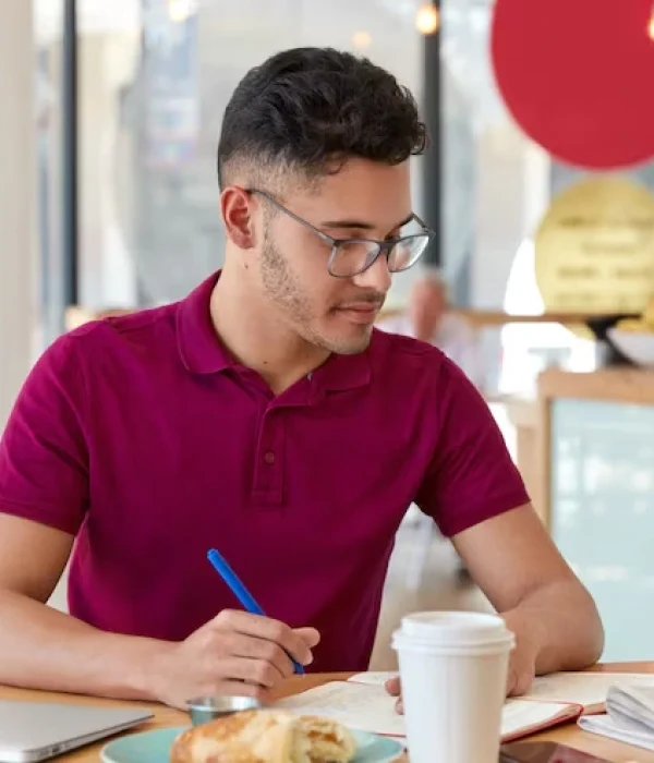 Asian Small Business Owner Holds a Pen