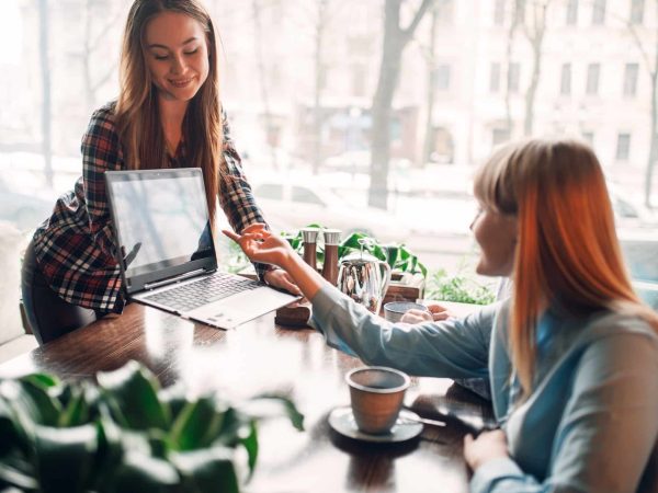 Business presentation on laptop in cafe, marketing