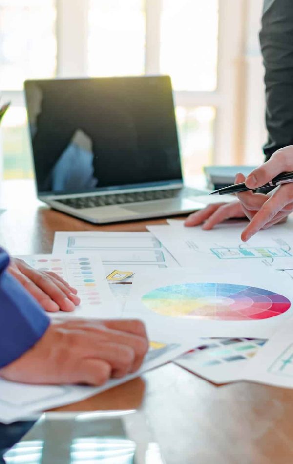 Group of designer creativity drawing a website outline and website ux app development on mobile phon Group of designer creativity drawing a website outline and website ux app development on mobile phon