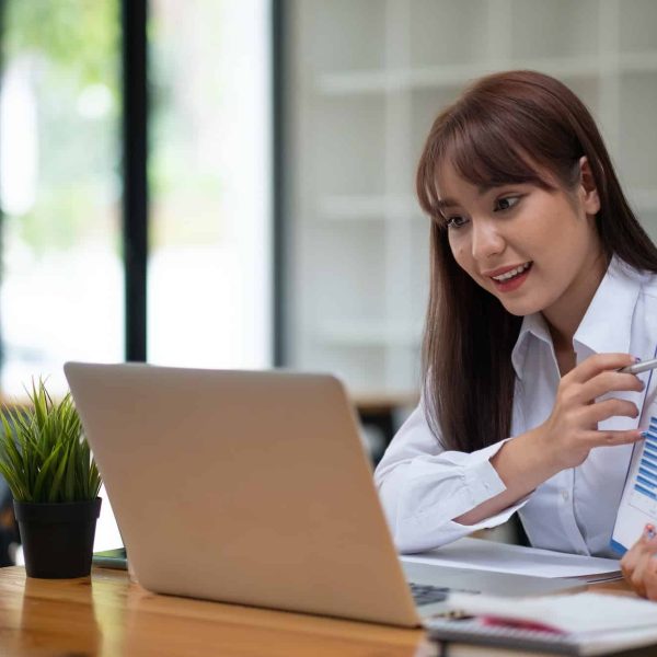 Portrait of attractive business female showing customer engagement graph report on online meeting, Top Experiential Design Agency London