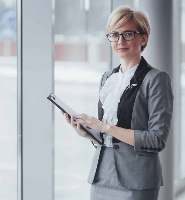 Smiling confident business woman looking at camera at office, Activations Agency In London, Digital Activation