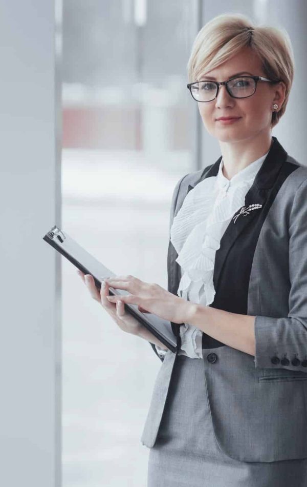 Smiling confident business woman looking at camera at office, Activations Agency In London, Digital Activation