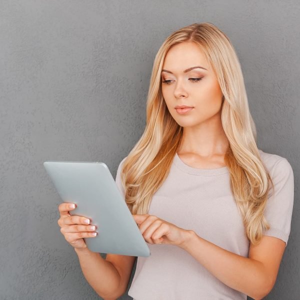 Working on her brand new tablet. Influencer Marketing Agency